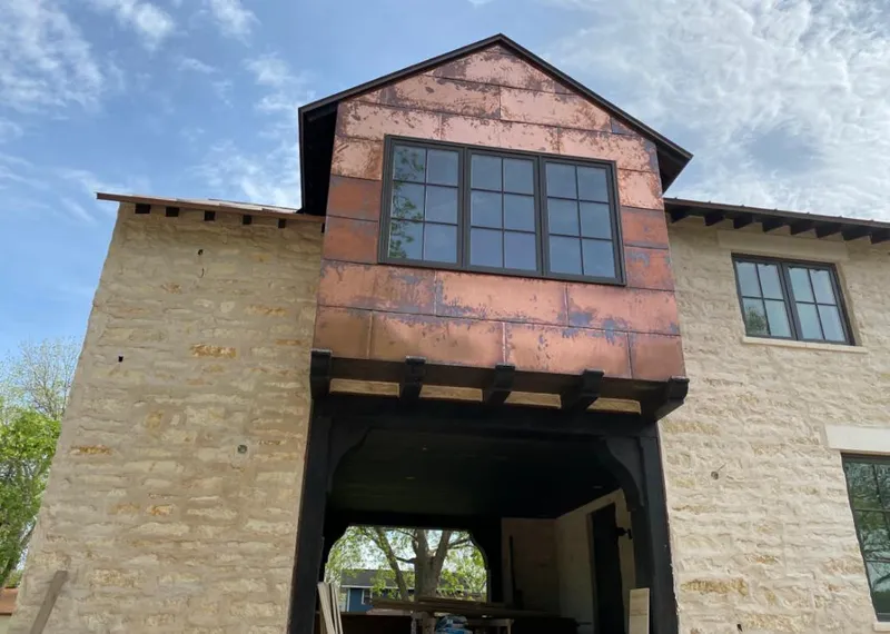 Copper metal panel facade on a stone building for Metal Roof Coating in Fallbrook