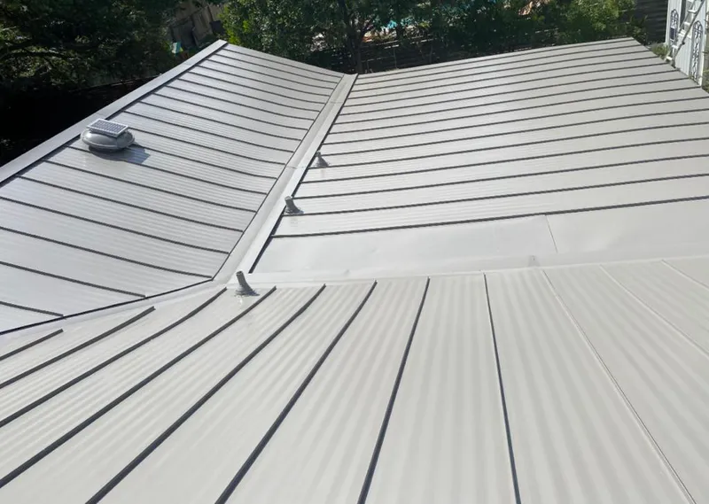 Solar attic fan installed on a metal roof for Roof Ventilation in Fallbrook